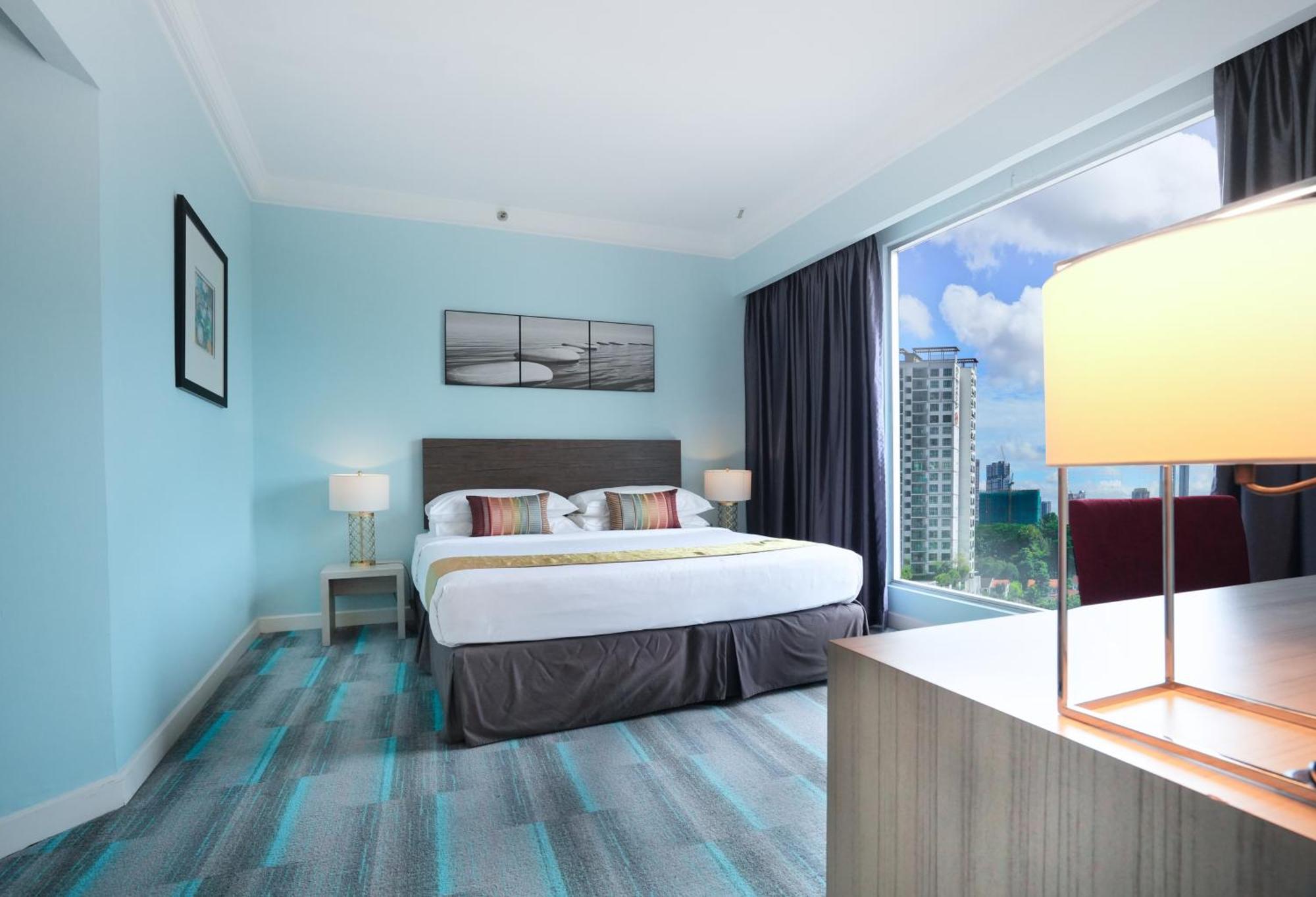 Thistle Johor Bahru Exterior photo A bedroom at the hotel